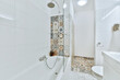 © ADDICTIVE STOCK - Bathroom interior with bathtub and shower
