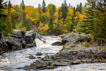 Cascading Waterfalls Tumbling Through Autumn Scenery In Jay Cooke State Park; Minnesota, United States Of America