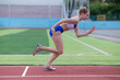 © Михаил Решетников - Young caucasian woman is engaged in jogging at the stadium outdoors.