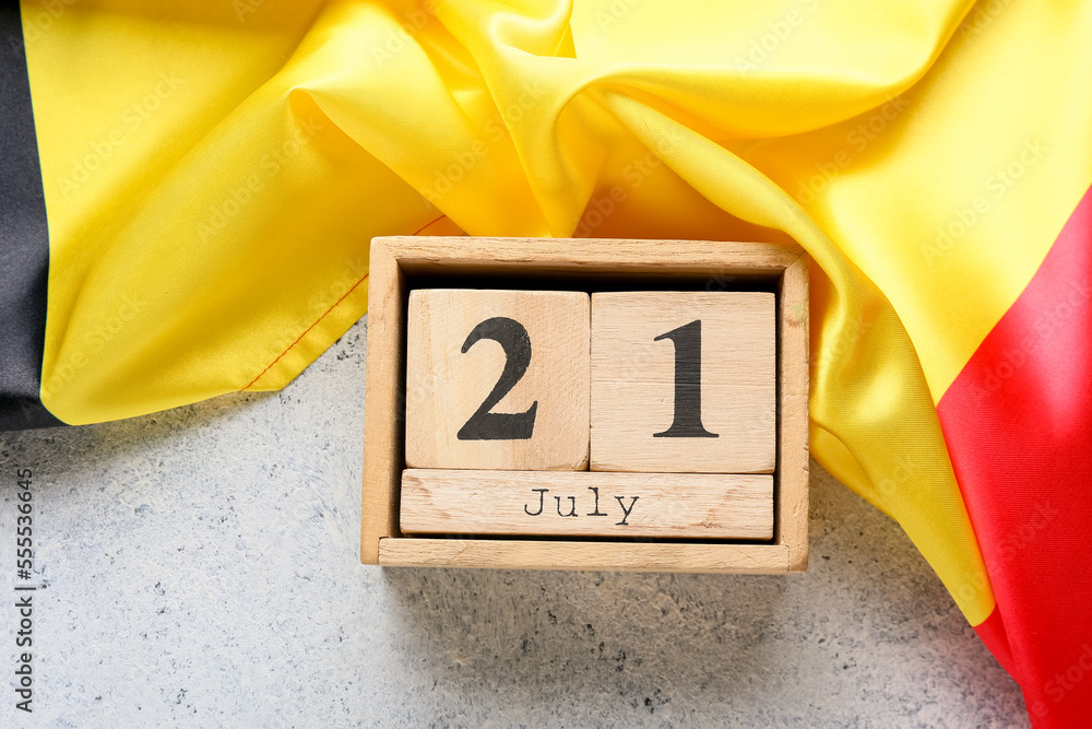 Flag of Belgium and cube calendar on light background, closeup