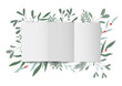 Świąteczna kompozycja zrobiona z kartki papieru, jemioły, zielonych gałązek i czerwonych jagód. List do Świętego Mikołaja albo kartka na Boże Narodzenie. Widok z góry - flat lay.