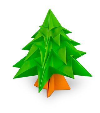 Green origami christmas tree isolated on white background