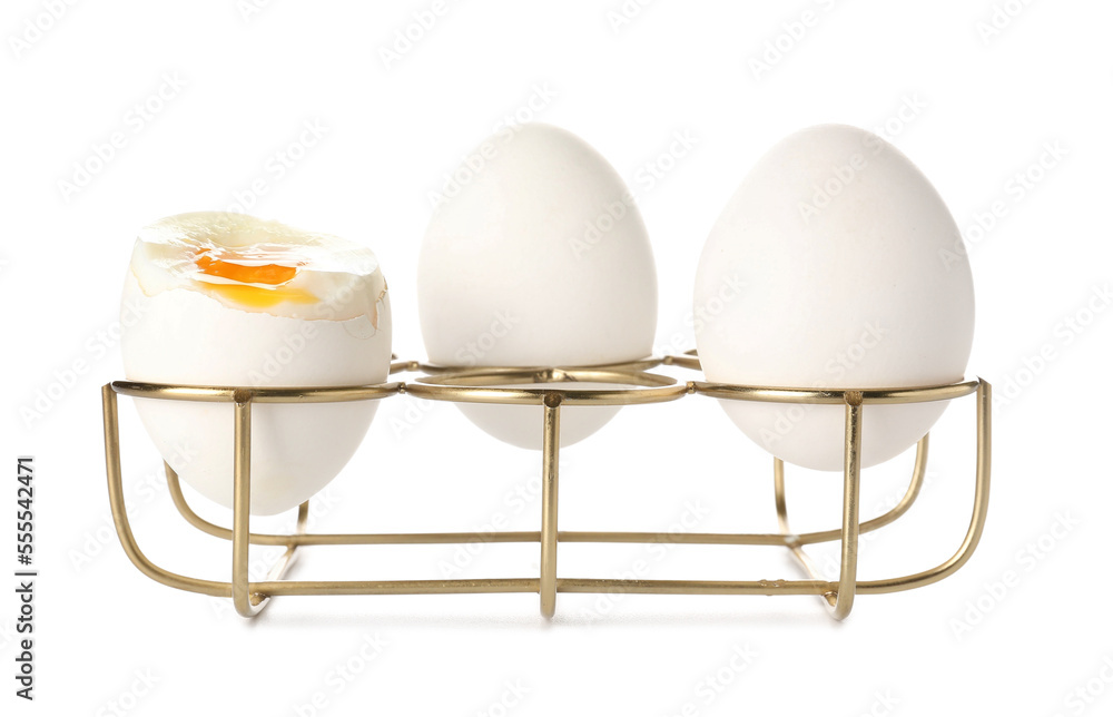 Soft boiled eggs in holder on white background