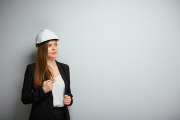 Wall Mural - Woman builder in black business suit isolated portrait.