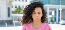Close Up Portrait Of Shy Hispanic Female Young Adult