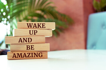 Poster - Wooden blocks with words 'Wake Up and Be Amazing'.