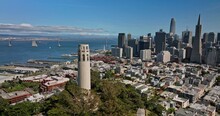 San Francisco California Aerial v109 panoramic 360 degree view, fly around coit tower in telegraph hill capturing bay area downtown cityscape and golden gate bridge - Shot with Mavic 3 Cine - May 2022