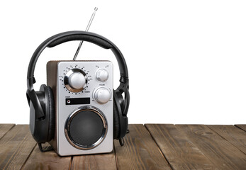 Sticker - Retro radio and headphones on wooden table