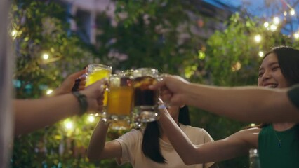 Wall Mural - Asian people having a barbecue party and drinking beer.