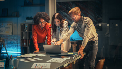 Leinwandbilder - Diverse Creative Colleagues Discussing a New Business Opportunity, Talking in an Office Meeting Room in the Evening. Close Up of a Tablet Computer with Project Planning and Development Timeline.