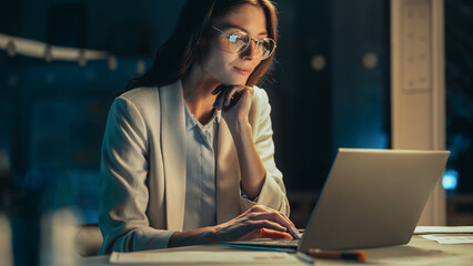 Aufkleber - Close Up Portrait of a Young Accountant Working in the Office Late in the Evening. Positive Female Using Laptop Computer, Preparing Job Assignment and Corporate Report for Finance Director.