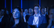 © Gorodenkoff - Young Man Sitting in a Crowded Audience at a Business Conference. Corporate Delegate Watching Inspirational Entrepreneurship Presentation About Developing Markets and Financial Opportunities.
