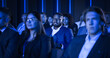 © Gorodenkoff - Black Man Sitting in a Crowded Audience at a Business Conference. Corporate Delegate is Focused on a Speech, While Listening to an Inspirational Entrepreneurship Presentation About Developing Markets.