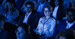 © Gorodenkoff - Beautiful Woman Sitting in Crowded Audience at a Business Conference. Female Delegate Using Laptop to Take Notes. Manager Watching Inspirational Entrepreneurship Presentation About Developing Markets.