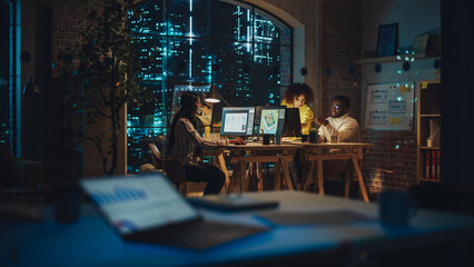 Poster - Two Creative Multicultural Colleagues Collaborate on a Project and Work Together as a Team. Marketing Manager and Designer Talking and Discussing Changes to an Advertising Campaign. Evening at Work.