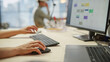 © Gorodenkoff - Close Up of a Woman's Hands Working on Keyboard and Monitor. Young Woman's hands Moving the Computer Mouse and Typing. Female Sales Manager Developing a Time Management Plan