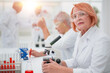 © ASDF - female scientist conducts a blood test in the laboratory.