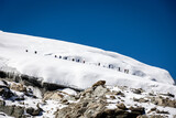Fototapeta  - Group Walking Up Mera Peak from Mera La
