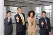 © Designpics - Group Portrait of Business People Making Rude Hand Gesture