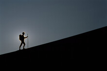 Silhouette Of Person Hiking Mesquite Dunes, Death Valley California, USA