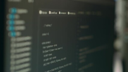 Computer display of software developer typing database functions script on terminal window, cloud computing. Displaying source code and hmtl script with it coding or programming language. Close up.
