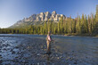 © Designpics - Man Fishing in Mountain River, Banff National Park, Alberta, Canada