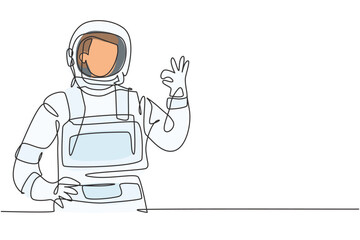 Wall Mural - Single one line drawing of male astronauts with gesture okay wearing spacesuits to explore outer space in search mysteries of universe. Modern continuous line draw design graphic vector illustration