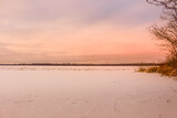 Fototapeta Zachód słońca - Beautiful winter landscape at the ravine Petrie Island, Ottawa river