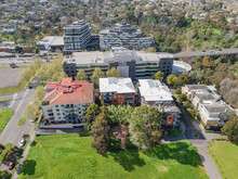 Aerial View Of Inner City Apartments Near Green Parkland