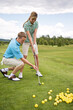 Couple Playing Golf, Burlington, Ontario, Canada