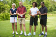 © Designpics - Portrait of Couples Standing and Leaning on Golf Clubs