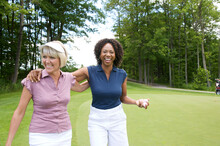 Women Walking On Golf Course
