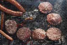 Close-up Of Burgers And Hot Dogs On The Barbecue, Houston, Texas, USA