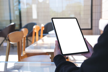 Mockup image of a woman holding digital tablet with blank white desktop screen