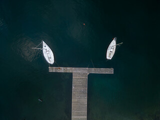 Aerial view of two yachts in the marina.