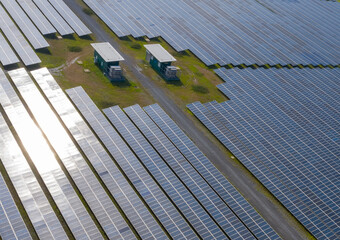 Aerial view of Solar Panels Farm (solar cell). Drone flight fly over solar panels field renewable green alternative energy concept in Thailand. solar energy. power plant.