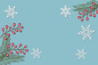 © Chitraporn - Red berries with snowflakes symbol on soft blue background. Christmas or winter composition and New year concept. Flat lay, top view, copy space for the text. illustration paper cut design style.