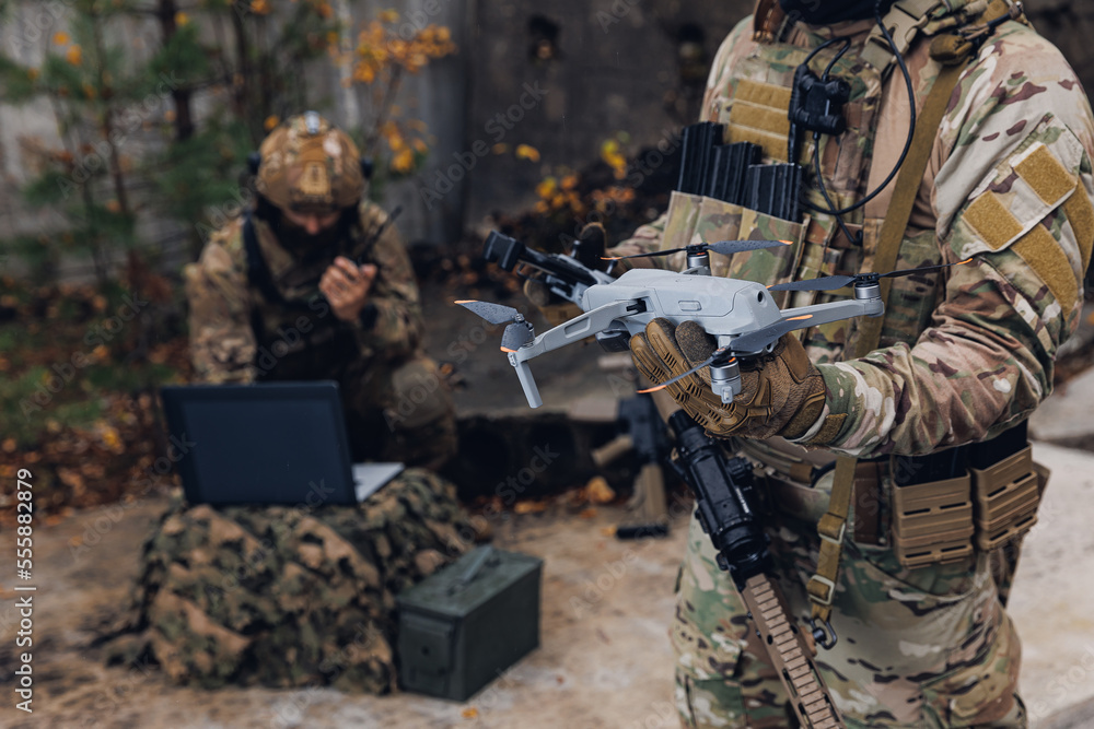 Soldiers Using Yarrow Modern army soldiers using aerial drone for artillery guidance and ...