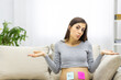 © Andrii - Photo of positive pregnant woman with pink and blue papers on the stomach which mean gender of her future baby.
