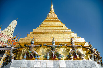 Giant statue carrying golden stupa in Wat Phra Kaew, Bangkok, Thailand