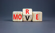 © Dzmitry - More move symbol. Concept word More move on wooden cubes. Beautiful grey table grey background. Business and more move concept. Copy space.