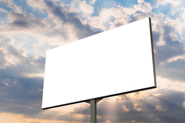 Wall Mural - blank white billboard against warm sunset sky. sun beams shining through dramatic clouds - mock up. 