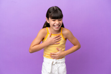 Sticker - Little caucasian kid isolated on purple background smiling a lot