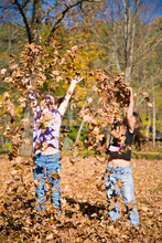 Girls Playing In Fall Leaves, Grafton, Vermont, USA