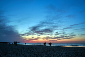 Wall Mural - sunset on a sandy beach by the Baltic sea in the evening