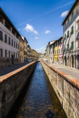 Wall Mural - Lucca, Italy. Picturesque river channel in the old town