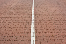 Close-up Of Road With Interlocking Brick Stones And White Line, Norderney, East Frisia Island, North Sea, Lower Saxony, Germany