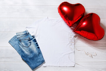 Wall Mural - White tshirt mockup. Valentines Day concept shirt, balloons heart shape on wooden background. Copy space, template blank front view t-shirt clothes. Romantic outfit. Flat lay holiday fashion
