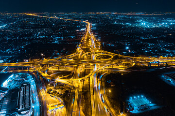 Sticker - Aerial top view of Modern Multilevel Motorway Junction with Toll Highway, Road traffic an important infrastructure, Expressway Road and Roundabout, Night scene, Transportation and travel concept.