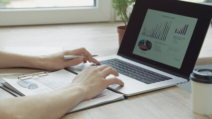 businessman works with a financial schedule. people and technology.
